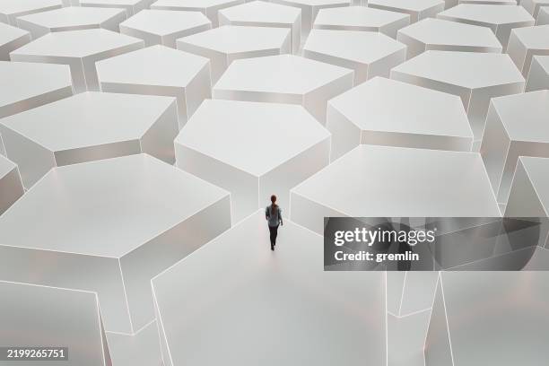 young woman in abstract maze - frosted glass stock pictures, royalty-free photos & images