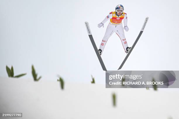 Yellow jersey holder Austria's Daniel Tschofenig takes his first round jump on the second day of the men's FIS Ski Jumping World Cup competition in...