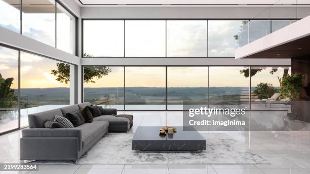 contemporary interior with large glass windows and sunset view - penthouse stockfoto's en -beelden