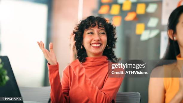 excited employee celebrating team success and work achievements - happy colleagues doing team building activity imagens e fotografias de stock