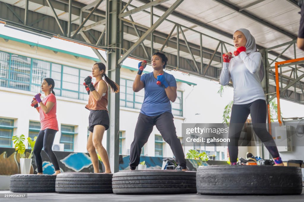 Female boxer warming up before training