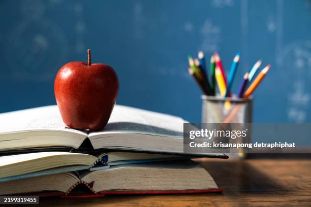 apple and book,education concept. - teachers desk books stock pictures, royalty-free photos & images