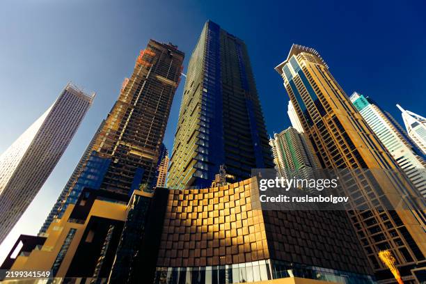 low angle view of skyscrapers, dubai, uae - vista de la tierra fotografías e imágenes de stock