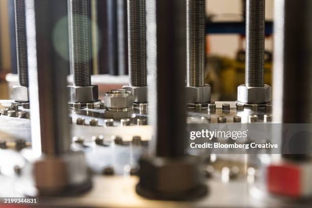 bolts on a electrolyzer stack - pfosten stock-fotos und bilder