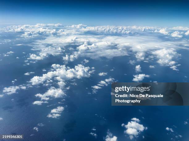 aerial view of clouds over the ocean - clouds from aircraft point of view stock pictures, royalty-free photos & images