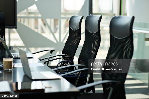 empty office chairs near table - bürostuhl stock-fotos und bilder