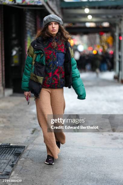 Guest wears light gray beret, dark green burgundy bordeaux pattern zipped sherpa pants, dark green black dark olive green patch pattern unzipped...
