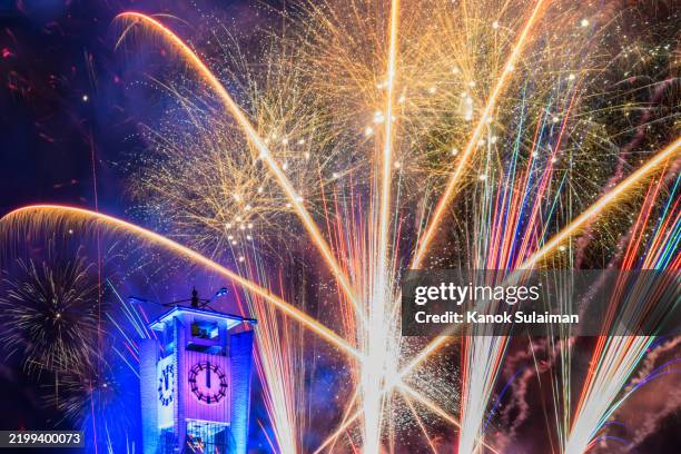new year fireworks over clock tower - exploding clock stock pictures, royalty-free photos & images
