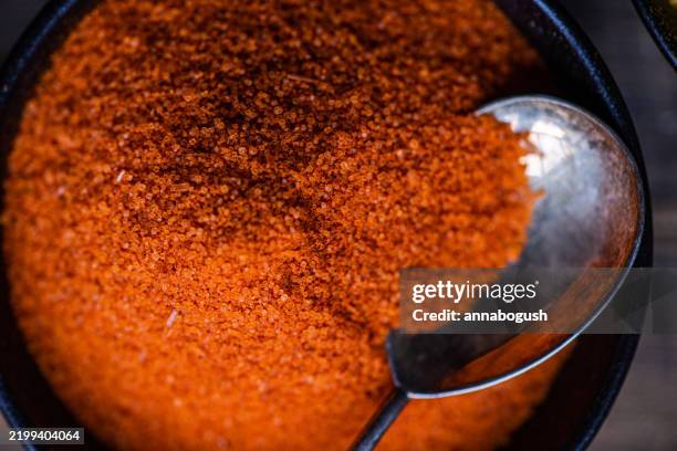 close-up overhead view of a bowl of paprika - paprika stock pictures, royalty-free photos & images