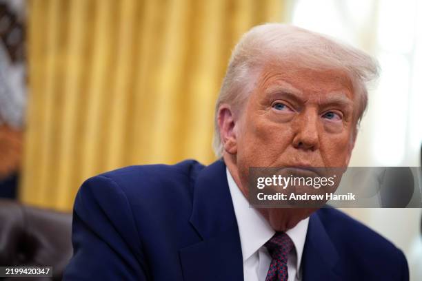 President Donald Trump delivers remarks after signing an executive order on reciprocal tariffs in the Oval Office at the White House on February 13,...
