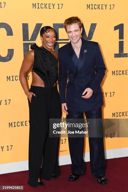 Naomi Ackie and Robert Pattinson attend the "Mickey 17" World Premiere at Cineworld Leicester Square on February 13, 2025 in London, England.