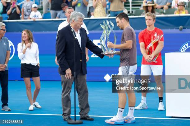 Miomir Kecmanovic receives the winners trophy at the Mens Singles Final of the Delray Beach Open on February 16 at Delray Beach Stadium & Tennis...