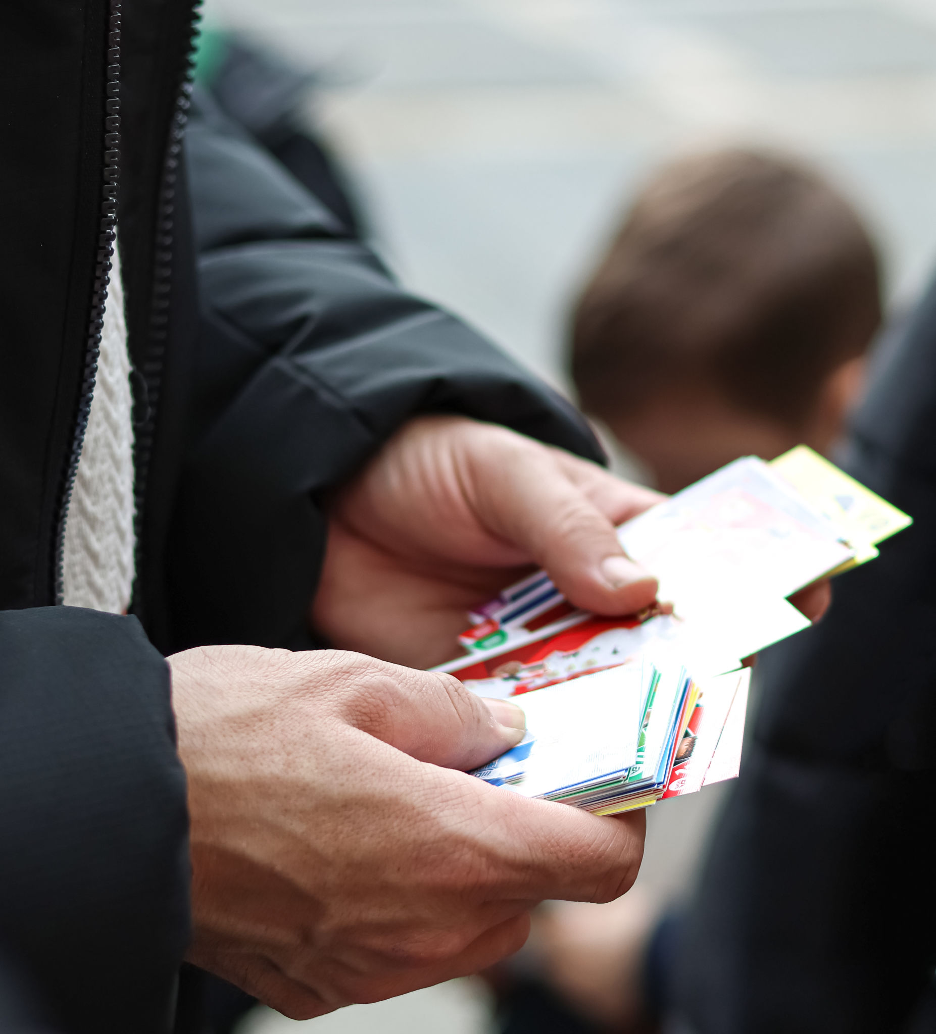 people trading cards