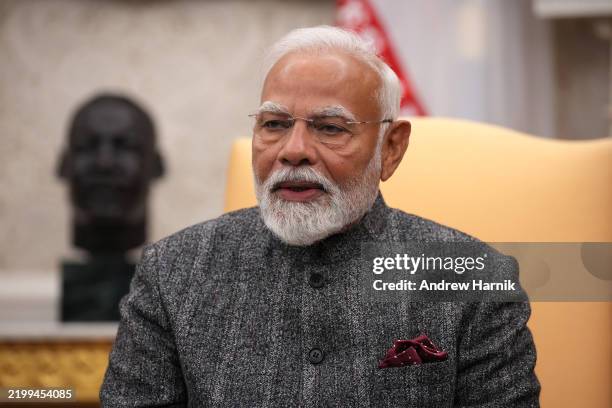 Indian Prime Minister Narendra Modi speaks during a meeting with U.S. President Donald Trump in the Oval Office at the White House on February 13,...