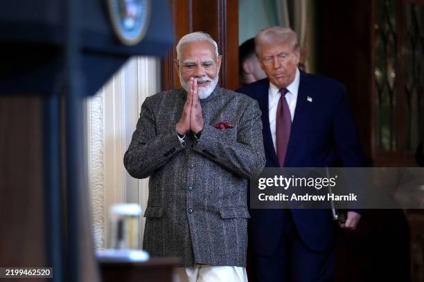 President Donald Trump and Indian Prime Minister Narendra Modi arrive for a joint press conference in the East Room at the White House on February...