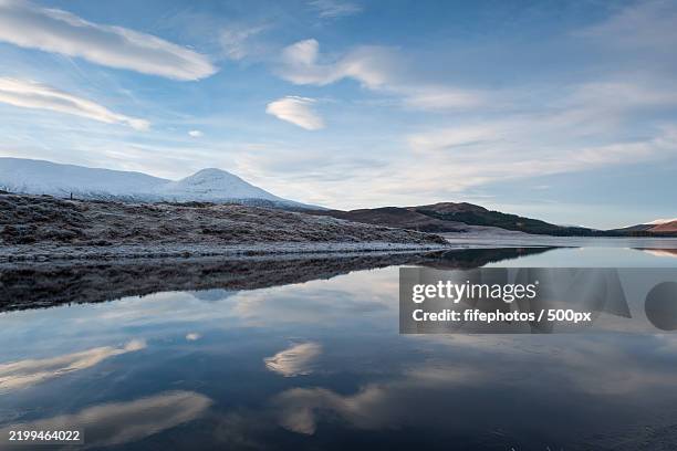 scenic view of lake by mountains against sky - stratovolcano stock pictures, royalty-free photos & images