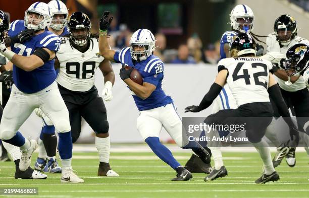 Jonathan Taylor of the Indianapolis Colts runs with the ball against the Jacksonville Jaguars at Lucas Oil Stadium on January 05, 2025 in...