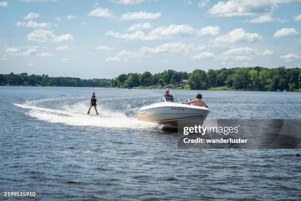 boating on pine lake, minnesota - waterskiing stock pictures, royalty-free photos & images