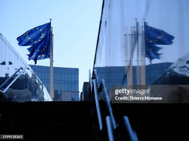 Flags fly in front of the Berlaymont, the EU Commission headquarter on February 17, 2025 in Brussels, Belgium. Today, the Commission has launched a...
