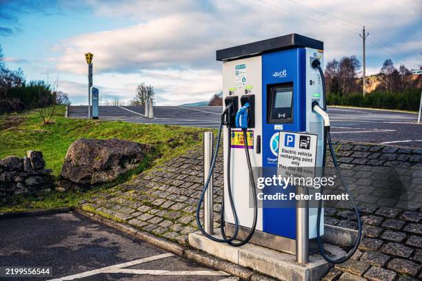 ev charging point in the scottish highlands - battery charger stock pictures, royalty-free photos & images