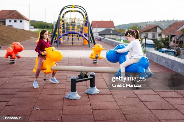 children are playing on the playground - gungbräda bildbanksfoton och bilder