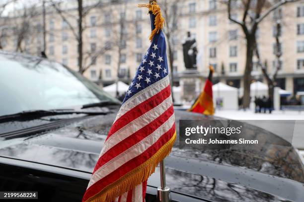 An US flag is seen on a delegation car whilst a bilateral meeting of vice president JD Vance with German president Frank-Walter Steinmeier takes...