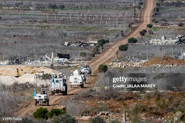 This picture taken from a position in northern Israel close to the border with Lebanon shows a convoy of United Nations Interim Force in Lebanon...