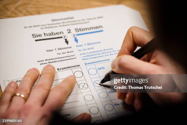 Symbolic photo on the topic of postal voting. Filling out a ballot paper for the 2025 federal election on February 17, 2025 in Berlin, Germany.