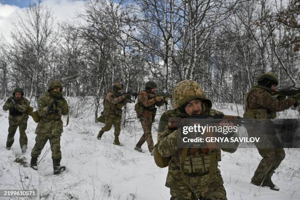 Ukrainian servicemen from the 24th Mechanised Brigade conduct a field training exercise in an undisclosed location in the Donetsk region, on February...