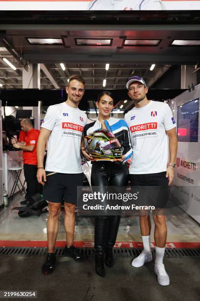 Nico Muller of Switzerland and Andretti Formula E and Jake Dennis of Great Britain and Andretti Formula E pose with Georgina Rodriguez outside the...