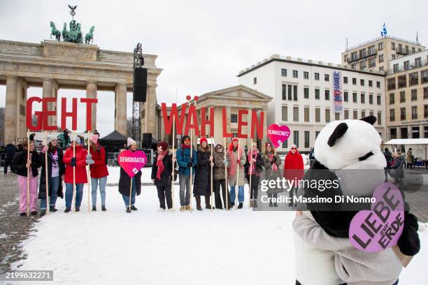 Supporters of the Fridays for Future climate action movement march in a climate strike on February 14, 2025 in Berlin, Germany. Germany is scheduled...