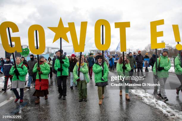 Supporters of the Fridays for Future climate action movement march in a climate strike on February 14, 2025 in Berlin, Germany. Germany is scheduled...