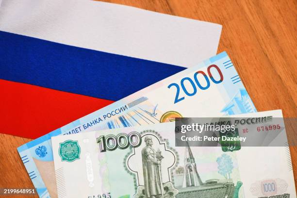 russian roubles and flag. - russian currency stock pictures, royalty-free photos & images
