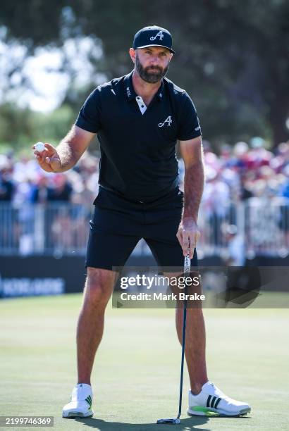 Dustin Johnson of 4 Aces acknowledges the crowd on the 18th green during LIV Golf Adelaide at The Grange Golf Club on February 15, 2025 in Adelaide,...