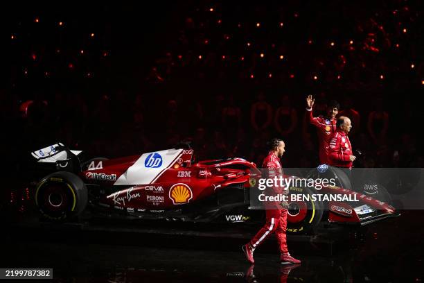 Ferrari's British driver Lewis Hamilton, Ferrari's French team principal Frederic Vasseur and Ferrari's Monaco driver Charles Leclerc stand by the...