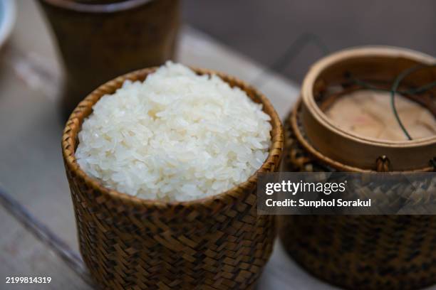 sticky rice in weaved bamboo container, laos - glutinous rice stock pictures, royalty-free photos & images