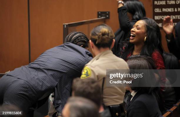 Rakim Mayers, aka A$AP Rocky, dives towards the gallery as the verdict is given in his felony assault trial at Clara Shortridge Foltz Criminal...