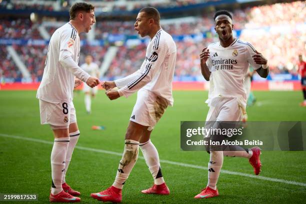 Kylian Mbappe of Real Madrid CF celebrates with his teammates after scoring his team's first goal during the LaLiga EA Sports match between CA...