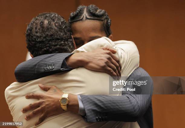 Rakim Mayers, aka A$AP Rocky, embraces attorney Joe Tacopina as the verdict is given in his felony assault trial at Clara Shortridge Foltz Criminal...
