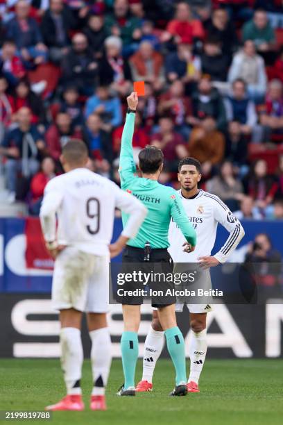 Jude Bellingham of Real Madrid CF receives a red card during the LaLiga EA Sports match between CA Osasuna and Real Madrid CF at Estadio El Sadar on...