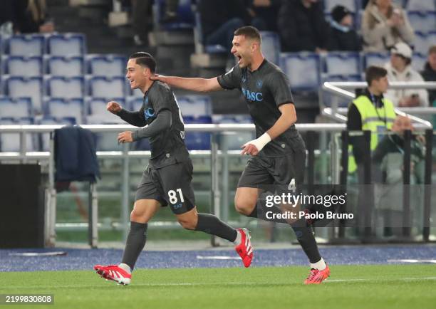 Giacomo Raspadori of Napoli celebrates scoring his team's first goal with teammate Alessandro Buongiorno during the Serie A match between SS Lazio...
