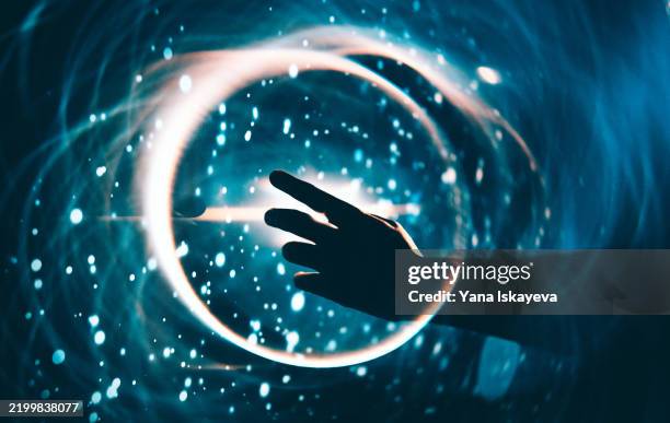 a person touching the digital interface. interaction with the unknown and cosmic exploration - big bang fotografías e imágenes de stock