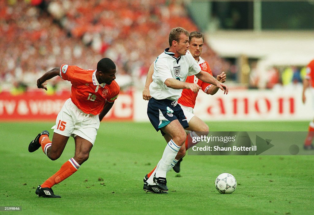 Alan Shearer of England and Winston Bogarde of Holland