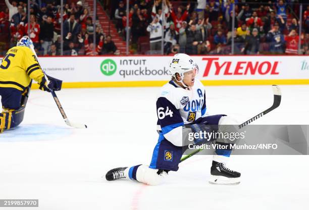 Mikael Granlund of Team Finland celebrates after scoring the game-winning goal as Linus Ullmark of Team Sweden looks on during the overtime period of...