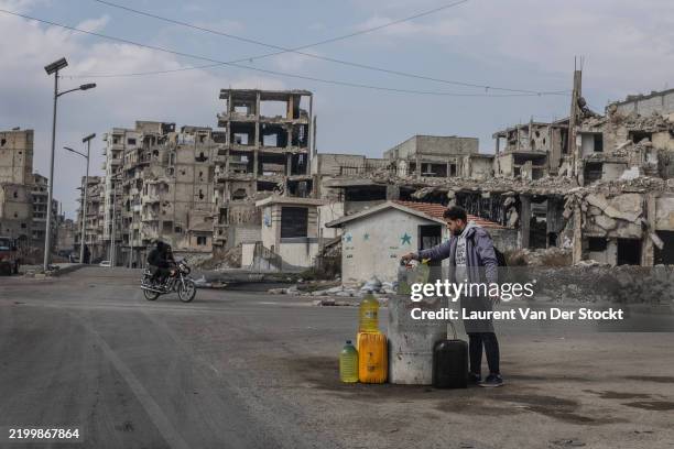 Gasoline seller at a crossroads in the city centre on January 31,2025 in Homs, Syria. Following the overthrow of Syrian leader Bashar al-Assad by...