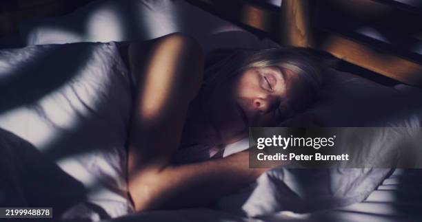 senior woman sleeping deeply - sleep breathing stock pictures, royalty-free photos & images