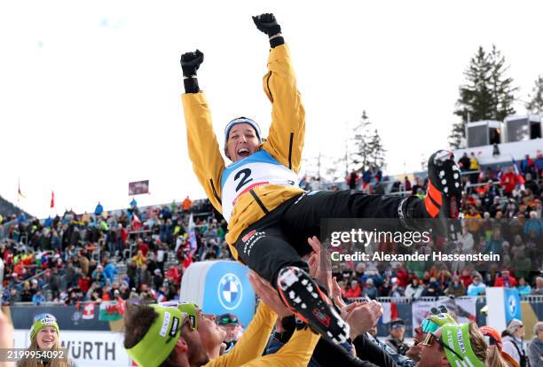 Gold medallist Franziska Preuss of Team Germany is lifted into the air by her team as they celebrate her victory during the medal ceremony for the...
