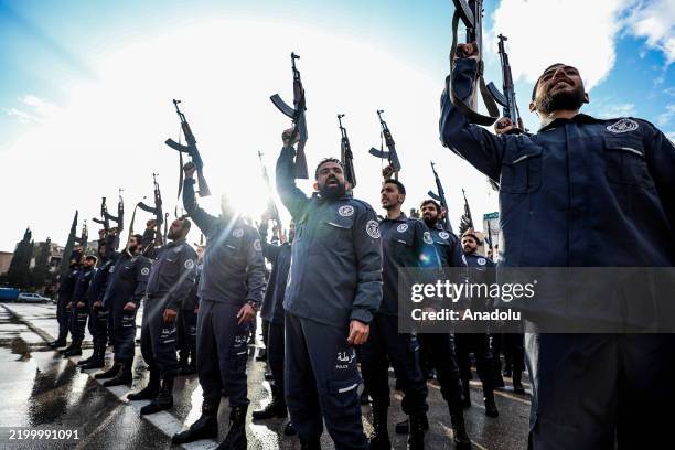 Newly graduated security officers participate in their graduation ceremony after completing their training at the General Security Administration...
