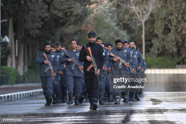 Newly graduated security officers participate in their graduation ceremony after completing their training at the General Security Administration...