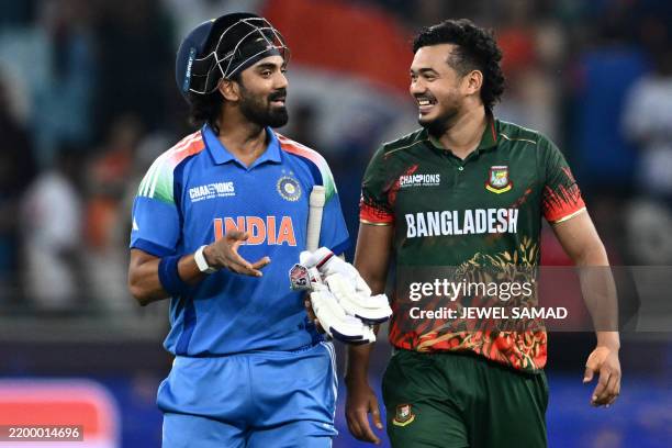 India's KL Rahul speaks with Bangladesh's Taskin Ahmed at the end of the ICC Champions Trophy one-day international cricket match between Bangladesh...